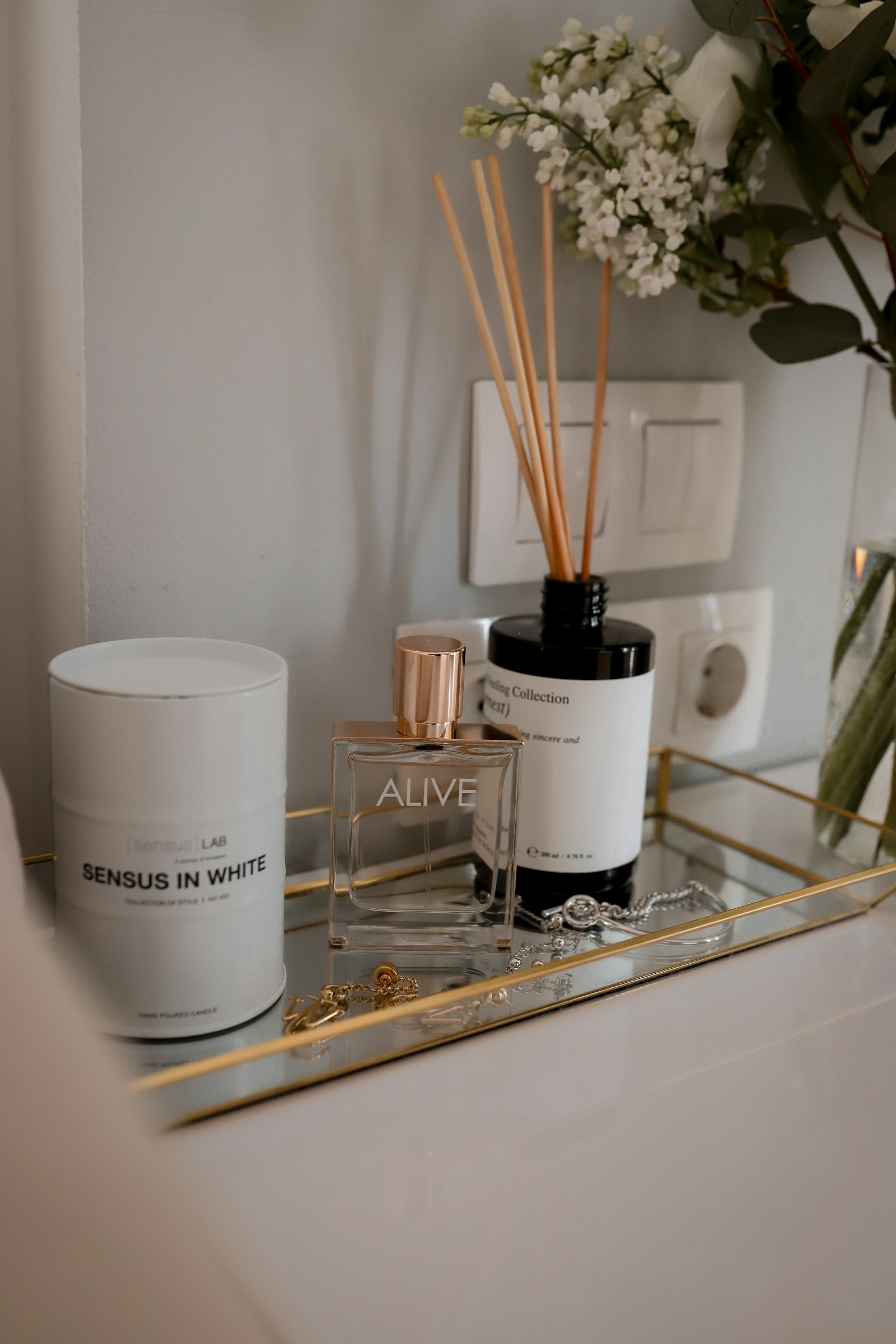 Calm bathroom counter with flowers and a candle